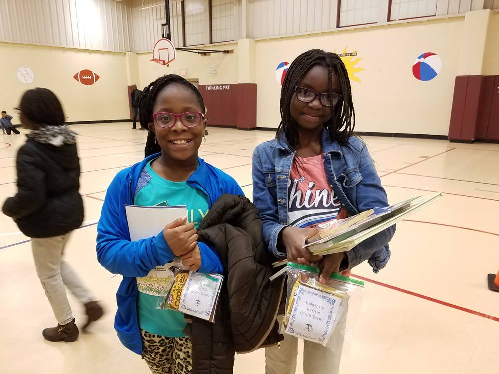 Sunnybrook School District students with books at|Sunnybrook SD logo