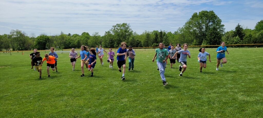 students running across a field