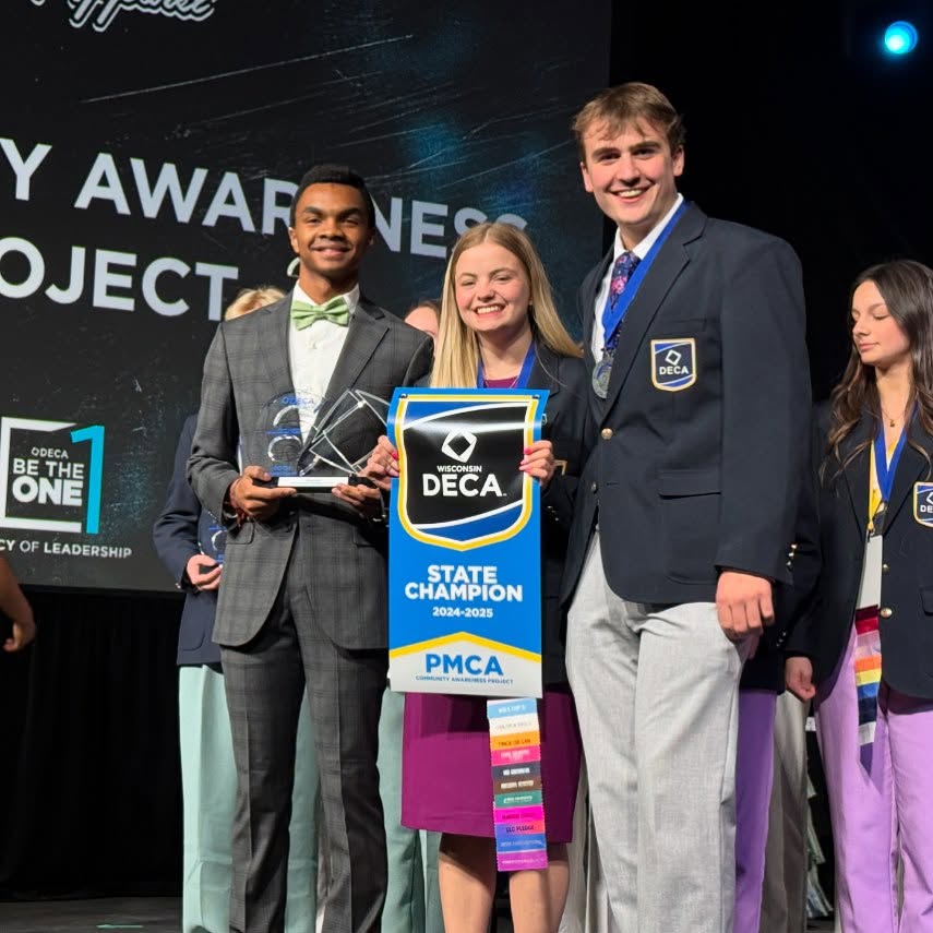 students accepting award at podium|WRPS logo